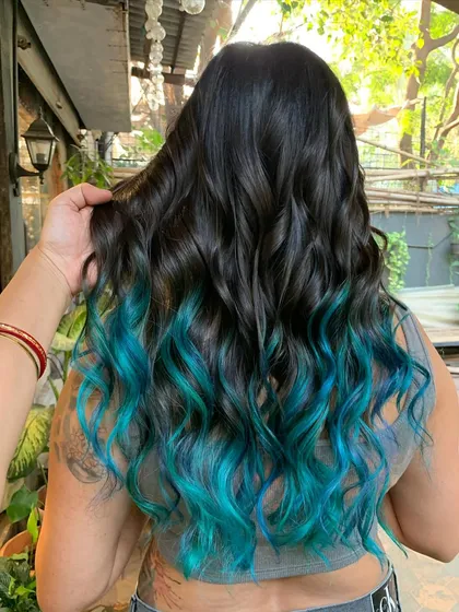A close-up of the hand-painted teal ombre. The transition from dark to light is seamless.