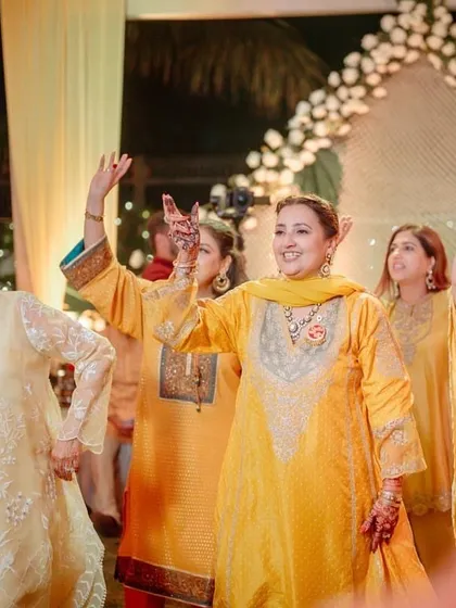 The joy and energy of a group dance at an outdoor mehendi function.