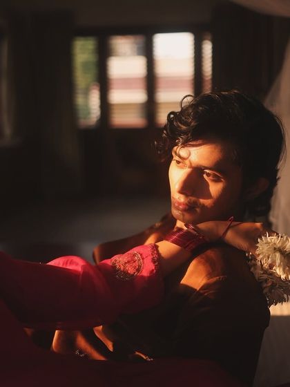 This shot captures the gentle, romantic narrative of the brand campaign. The styling, with its soft fabrics and traditional elements, supports the story of quiet connection.