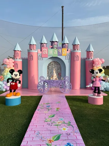 A grand Mickey and Minnie castle setup for Anaya's birthday. This shows our ability to create large-scale, impressive structures for outdoor parties.