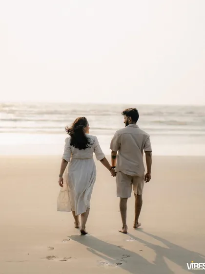 Walking hand-in-hand towards the future. This shot from a beach pre-wedding session captures a sense of journey and togetherness.