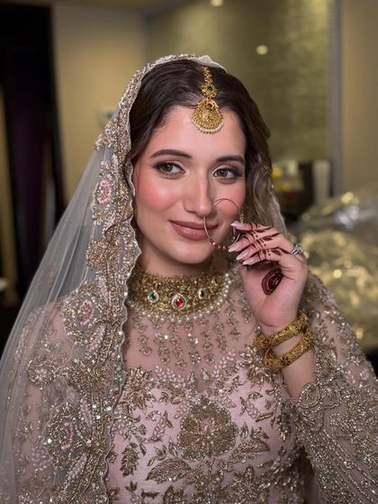 A final portrait of this stunning bride. The focus is on her luminous skin and bright eyes, a look that feels both traditional for a Nikkah ceremony and modern in its freshness.