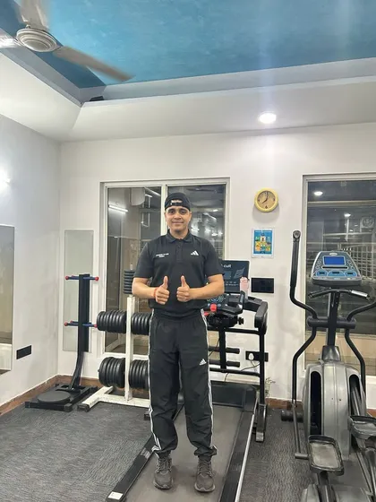 Thumbs up in the home gym setup.