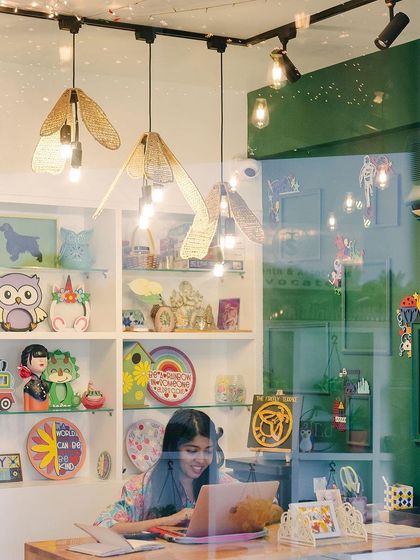 Another view of the studio from the reception desk. The shelves are packed with examples of finished projects, giving you a taste of the dozens of creative activities you can choose from.