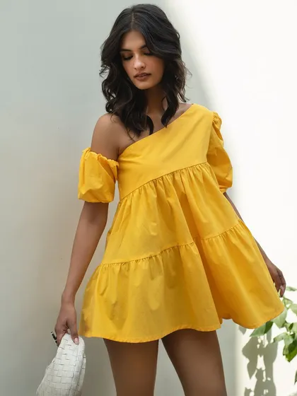 A playful yellow dress from It Girl, captured in a way that shows its fun, flirty silhouette.