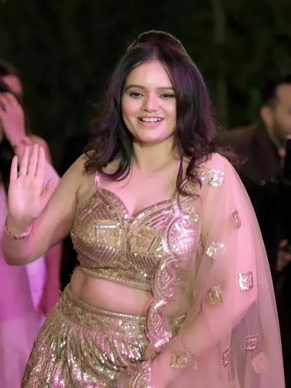 A candid dancing shot, showing that the HD party makeup stays put even through a night of celebration.