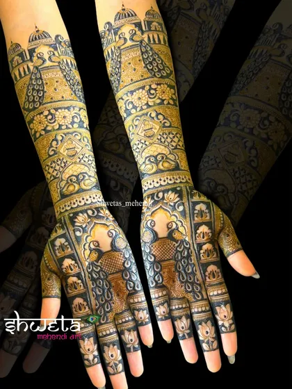 A stunning full-arm bridal design featuring majestic peacocks and architectural dome motifs. The use of negative space and dark shading makes the intricate details pop.