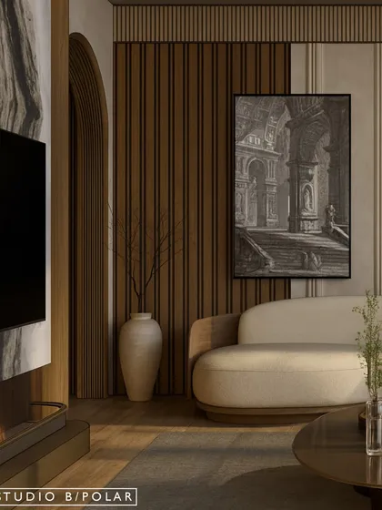 The interplay of textures, from the fluted wood paneling to the smooth marble of the TV wall, adds depth and character. A large piece of art complements the architectural elements, making the wall a feature in itself.
