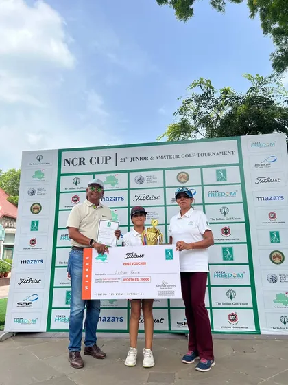 Aaliyah Kalra receives her winner's trophy for Category C at the 21st NCR Amateur & Junior Golf Championship in Delhi.