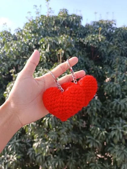 Simple and sweet. A pair of bright red heart keychains, perfect for Valentine's Day promotions or as a symbol of love.