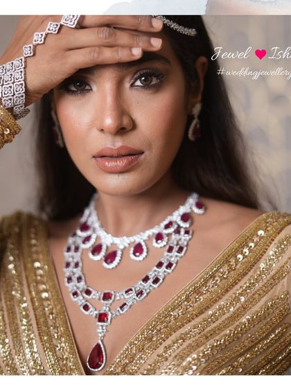 Jewellery that makes you feel powerful. This shot highlights the full ruby and diamond set, including the delicate hathphool and statement ring. Every piece is designed to work together to create a cohesive, head-turning look.