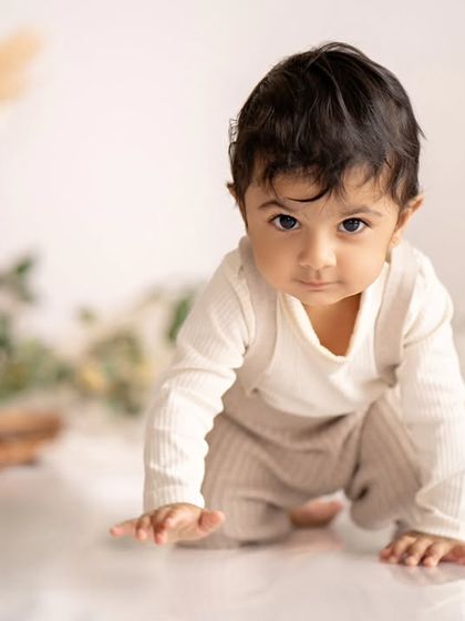 A duplicate of the happy baby crawling in his minimalist boho setup.