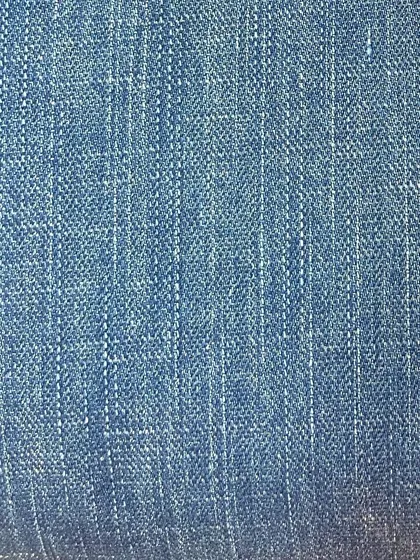 This light wash denim has a vertical slub texture, giving it a vintage, pre-worn look that adds character to any custom garment.
