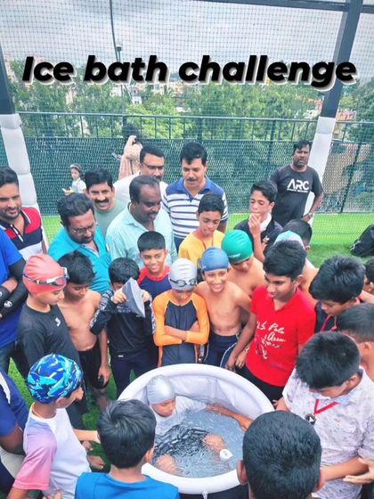The 'Ice Bath Challenge' in full swing, with parents and coaches looking on. It takes a village to support a young athlete's journey.