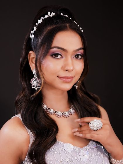 A smiling portrait that shows how this soft glam look enhances the model's features beautifully.