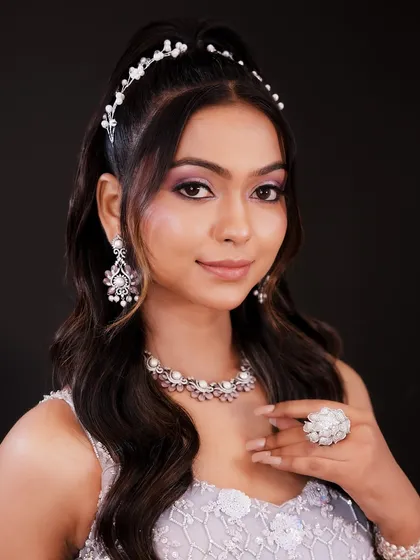 A smiling portrait that shows how this soft glam look enhances the model's features beautifully.