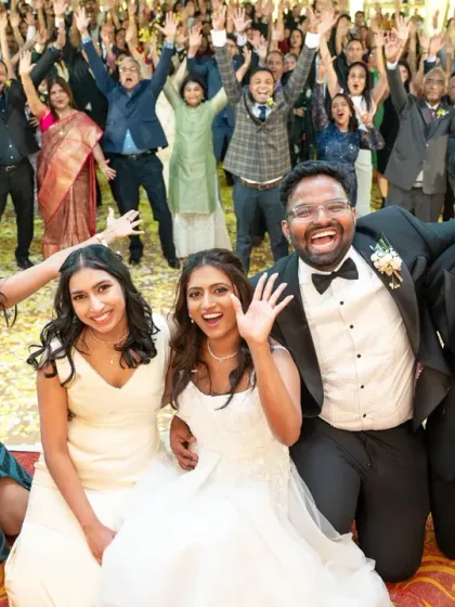 A photo with everyone! Capturing the couple with their wedding party and all their guests in one epic shot is a fantastic way to remember everyone who celebrated with you.
