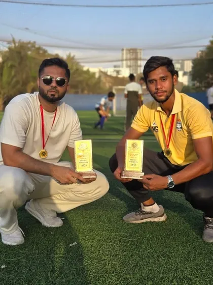 Our founder and a senior coach with their awards, recognizing their leadership and dedication.