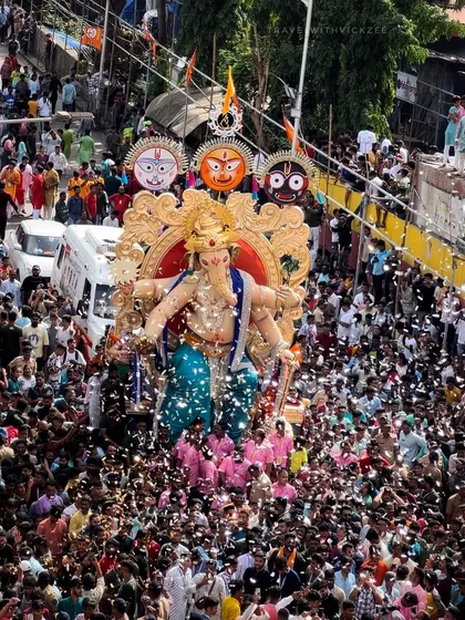 A shower of confetti over the Chinchpoklicha Chintamani procession. I focus on capturing these moments of pure joy and celebration that erupt spontaneously in the crowd.