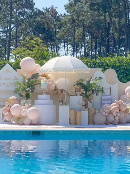 Let's take the party poolside. This boho pool party setup shows how I can transform any space, even outdoors, into a chic and stylish venue for a birthday, bridal shower, or anniversary, complete with custom backdrops and themed props.