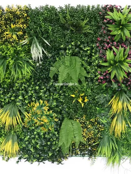 A close-up view of one of our custom vertical garden panels, showcasing a rich mix of artificial ferns, grasses, and colorful foliage to create a realistic, dense green wall.