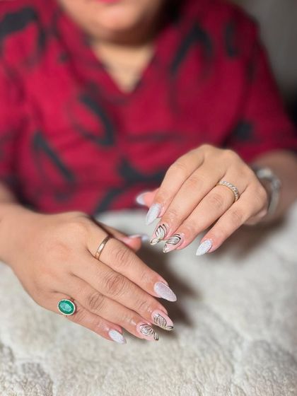 A white textured base with delicate black butterfly wing art. The contrast between the texture and the fine lines is beautiful.