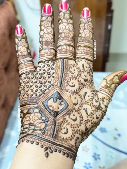 Another angle of this intricate back-hand design. The combination of swirls, checks, and floral elements creates a very rich and detailed look.