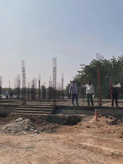 The foundational stage of a new villa development in Nashik. This image captures the very beginning of the construction process, with concrete pillars rising from the ground, marking the footprint of a future bespoke home.
