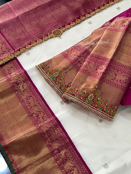 The sleeves of this blouse are made from brocade fabric and embellished with kemp stone work.