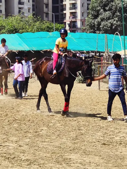A young girl enjoys her guided ride during a club event. Our trainers are always on hand to lead the horses, giving parents peace of mind and kids a fantastic experience.
