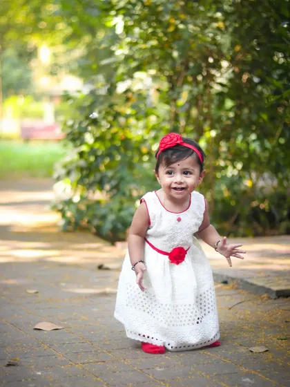 Another angle from an outdoor kids photography session, showing a happy, natural smile. These sessions are all about capturing your child's true personality.