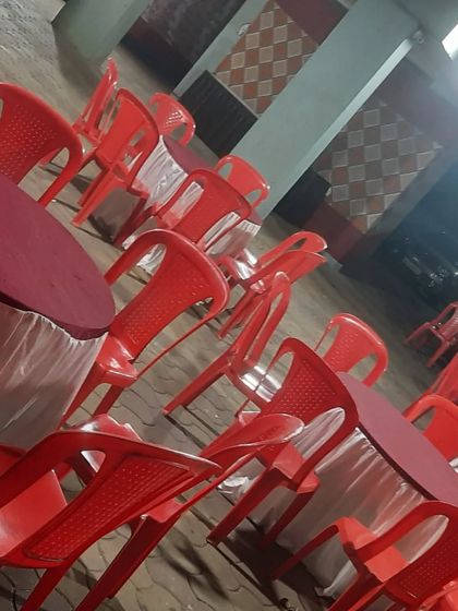 Round tables and chairs set up for guest seating. I ensure all furniture is clean and arranged properly.