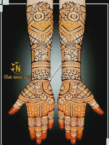 An Indo floral fusion design that fills the hands completely. The pattern uses a mix of geometric grids, floral bands, and lotus motifs for a balanced and intricate look.