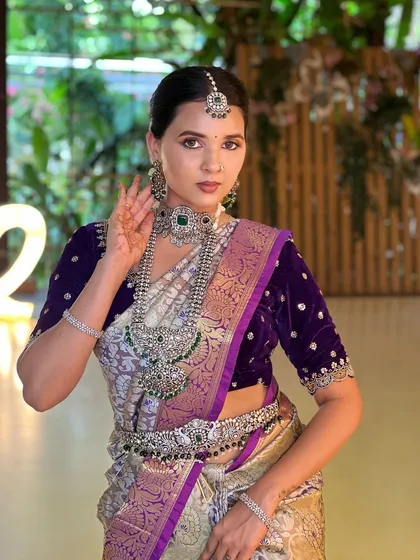 For brides who want a modern yet traditional touch, my silver-finish jewellery with green stones is a wonderful choice. It pairs beautifully with rich fabrics like velvet and offers a unique, contemporary bridal style.