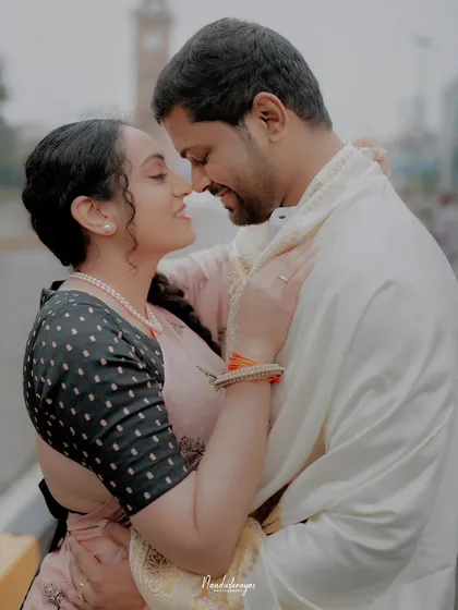 An intimate close-up of a couple in Mysore, their genuine smiles and embrace telling a story of love.