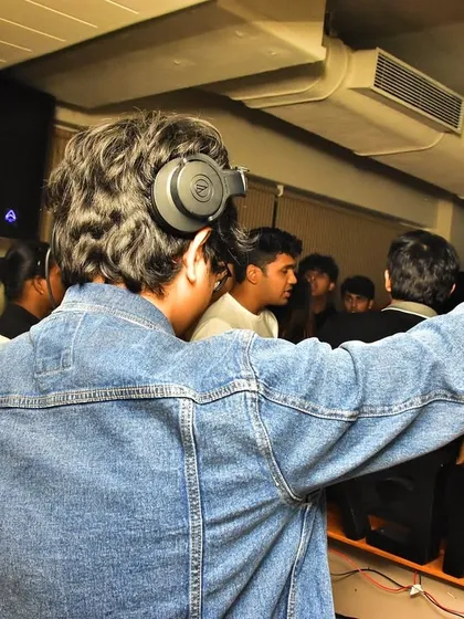A shot from behind, showing my focus on the music and my connection with the crowd. Leading the party from the DJ booth.