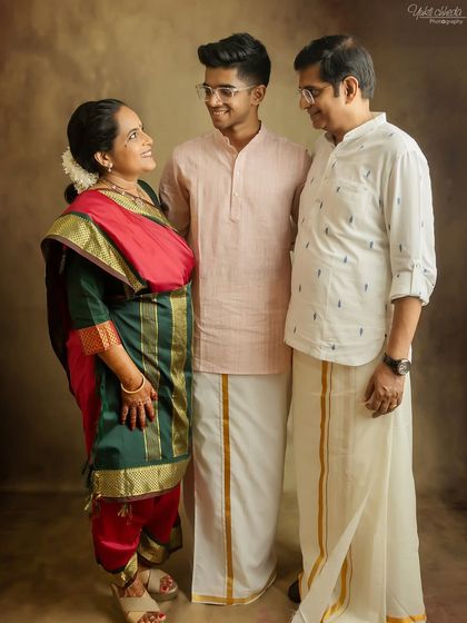 A candid and loving moment between the family during their 25th anniversary photoshoot.