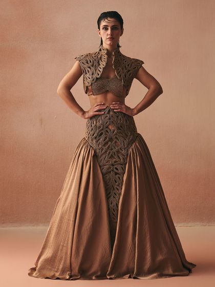 The Hilo lehenga from the 'Cord Memory' collection, featuring a handcrafted corded jacket in zari that crowns a satin bralette, flowing into a voluminous skirt.
