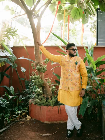 The groom looking dapper in his yellow kurta, ready for the Haldi celebrations to begin.