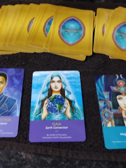 This is an example of a three-card spread using an Oracle deck, focusing on healing and purpose. Here, the cards for Divine Director, Gaia, and Isis point towards intervention, grounding, and manifestation. Each reading is a personal message for you.