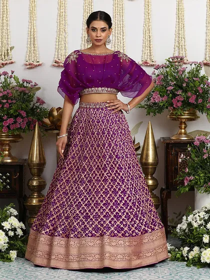 The full view of the purple lehenga with the cape blouse, a perfect fusion of traditional craft and modern style.
