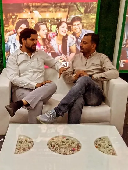 In conversation with a friend. The caption wisely notes, "Complaints also have their own dignity; they are not made to just anyone."