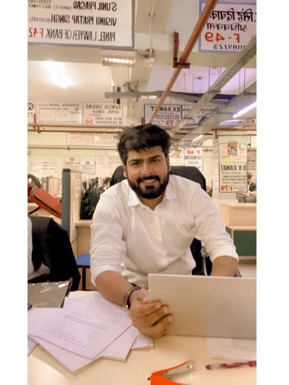 Working late in the library. The pursuit of justice often requires long hours, and I am committed to putting in the effort your case deserves.