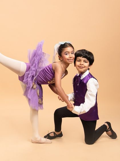 Our youngest performers capturing the playful and fiery spirit of Kitri and Basilio from 'Don Quixote.' This pose shows the personality and flair we encourage in all our dancers.