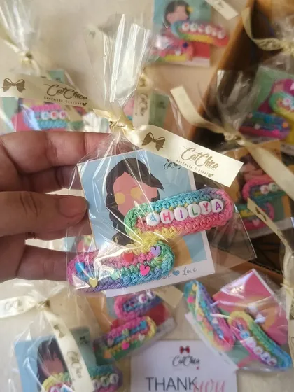 Here's one of our name clip sets for 'Holla' being packaged with a ribbon. We take extra care to make sure even the smallest orders feel special.