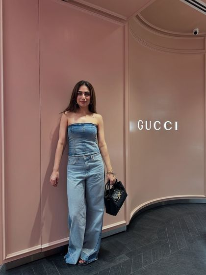 A full denim-on-denim look with a strapless corset top and matching wide-leg jeans. This is a bold, fashion-forward way to wear denim.