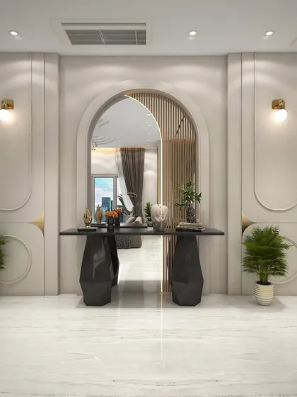An elegant entryway concept with an arched mirror and a sculptural console table. The design uses wall paneling and subtle lighting to create a grand and welcoming first impression.