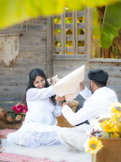 Another angle of the playful pillow fight, capturing the energy and fun of the moment.