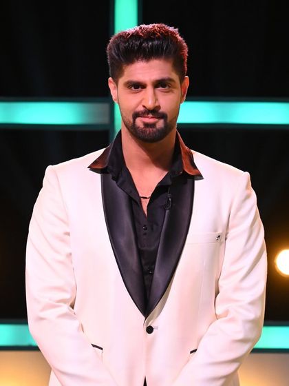 As seen on MTV Splitsvilla host Tanuj Virmani. This white tuxedo with a black shawl collar is a perfect example of our designer suits for any glamorous occasion.
