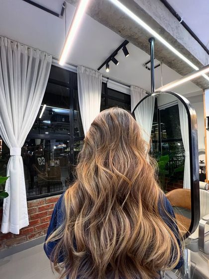 A closer look at the brunette balayage, where you can see the delicate hand-painting technique that creates such a natural, sun-kissed effect.